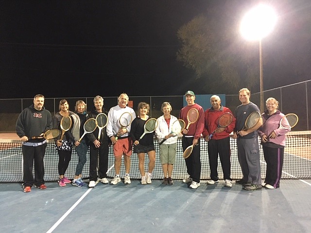 Participants in the season-ending Fall Classic Wooden Racquet Tennis Tournament show off their old-school racquets after the Oct. 23 event.