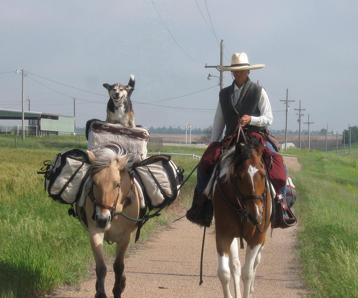 (Courtesy Photo)
Bernice Ende riding Hart, with her dog Claire riding Essie Pearl.