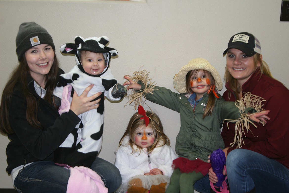 Pictured during the judging for the Plains Lions Club Halloween Costume Contest are, from left, Alyssa and her daughter Mary Moo Cow, Clara the Chicken, Gracelyn the Scarecrow, and their mom Christina.