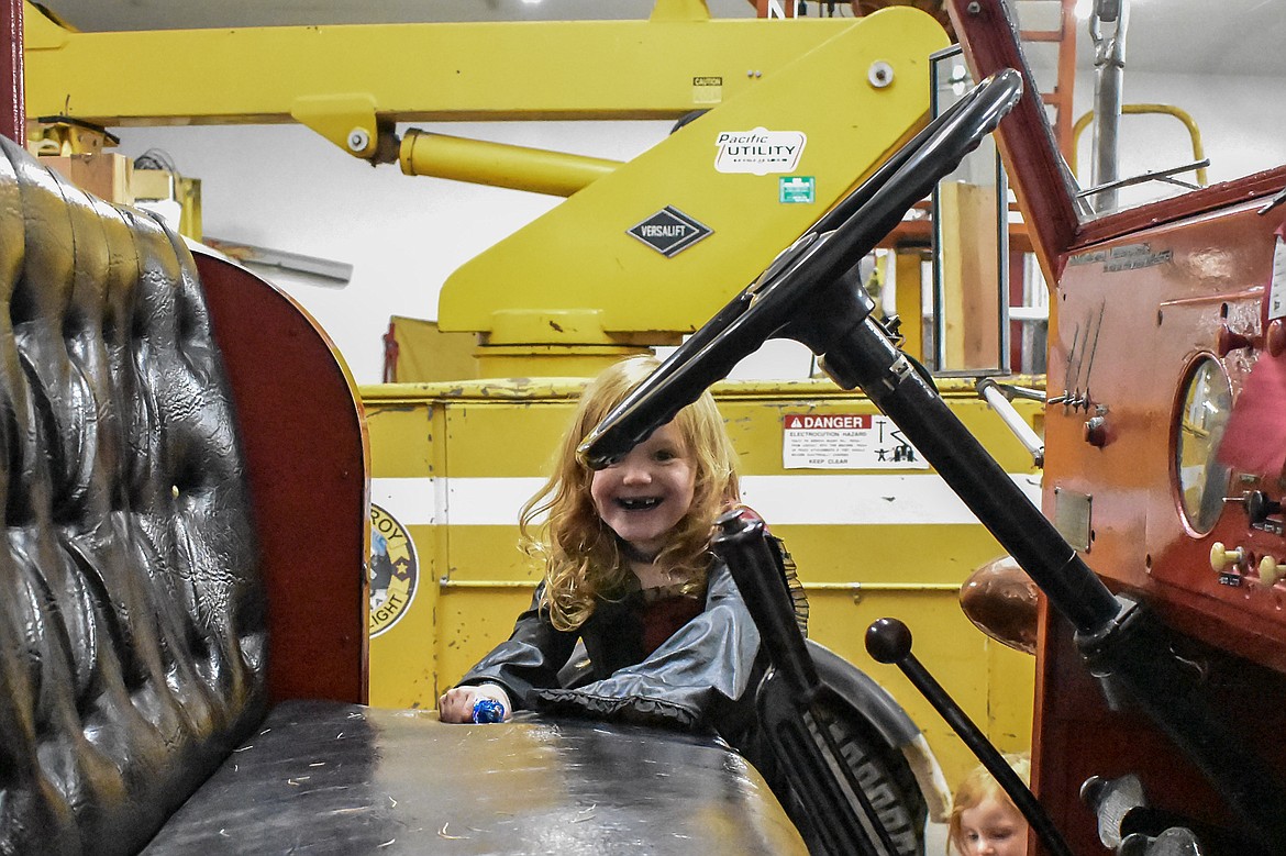 Audrey Towery took an eager eye to the Troy Volunteer Fire Department&#146;s Seagrave fire engine during the department&#146;s Halloween open house Wednesday. (Ben Kibbey/The Western News)