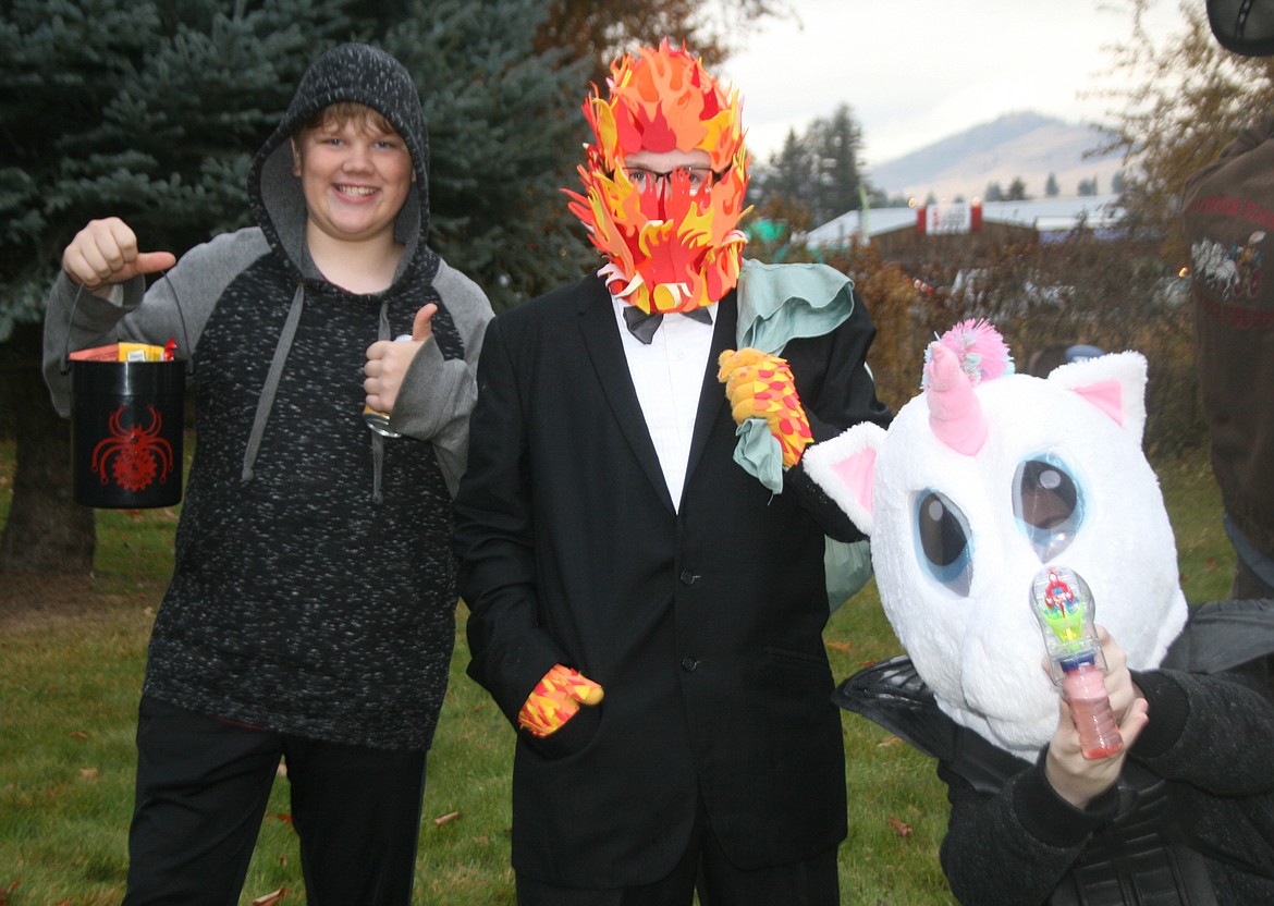 Some of the older trick or treaters having fun at Fred Young Park during the Plains Lions Club Halloween Costume Contest are, from left, Aiden, Kaedin and Logan.