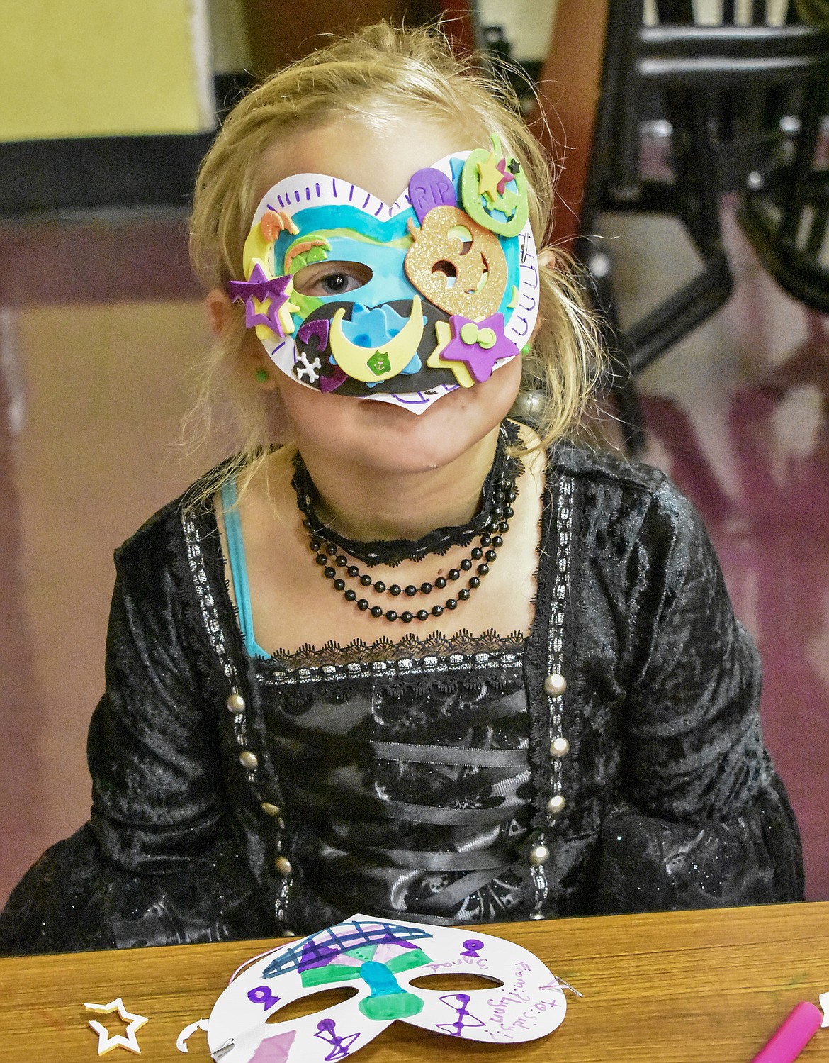 Lynn Bush shows off her meticulously crafted Halloween mask at Troy&#146;s W.F. Morrison Elementary during the After School Program Halloween Carnival Wednesday, a part of the ASP&#146;s Lights On After School programs. (Ben Kibbey/The Western News)