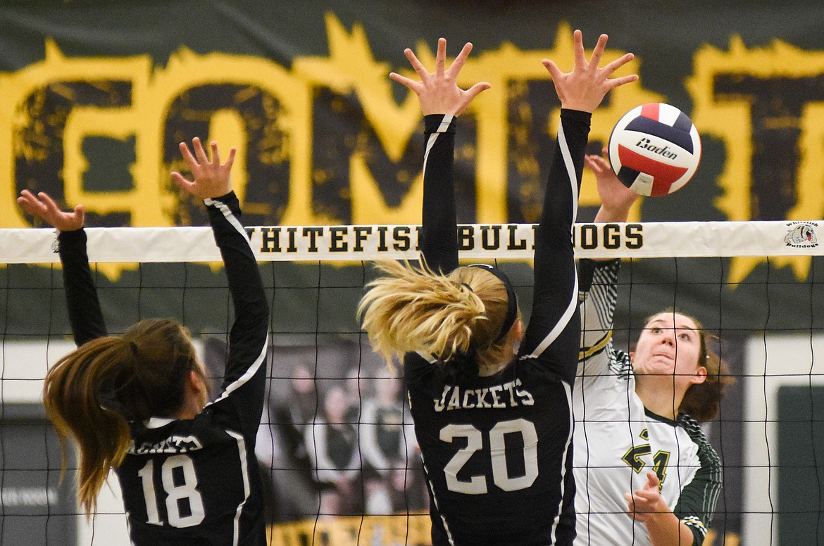 Marlee Bender smashes the ball against Dillon in the Western A Divisional Tournament last week at Whitefish High School. (Daniel McKay/Whitefish Pilot)