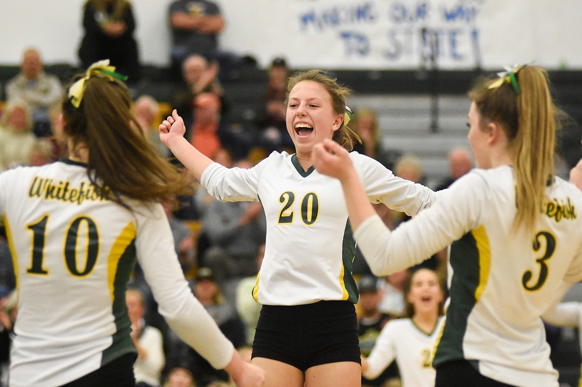 Mikenna Ells celebrates with her teammates in the Western A Divisional Tournament last week at Whitefish High School. (Daniel McKay/Whitefish Pilot)