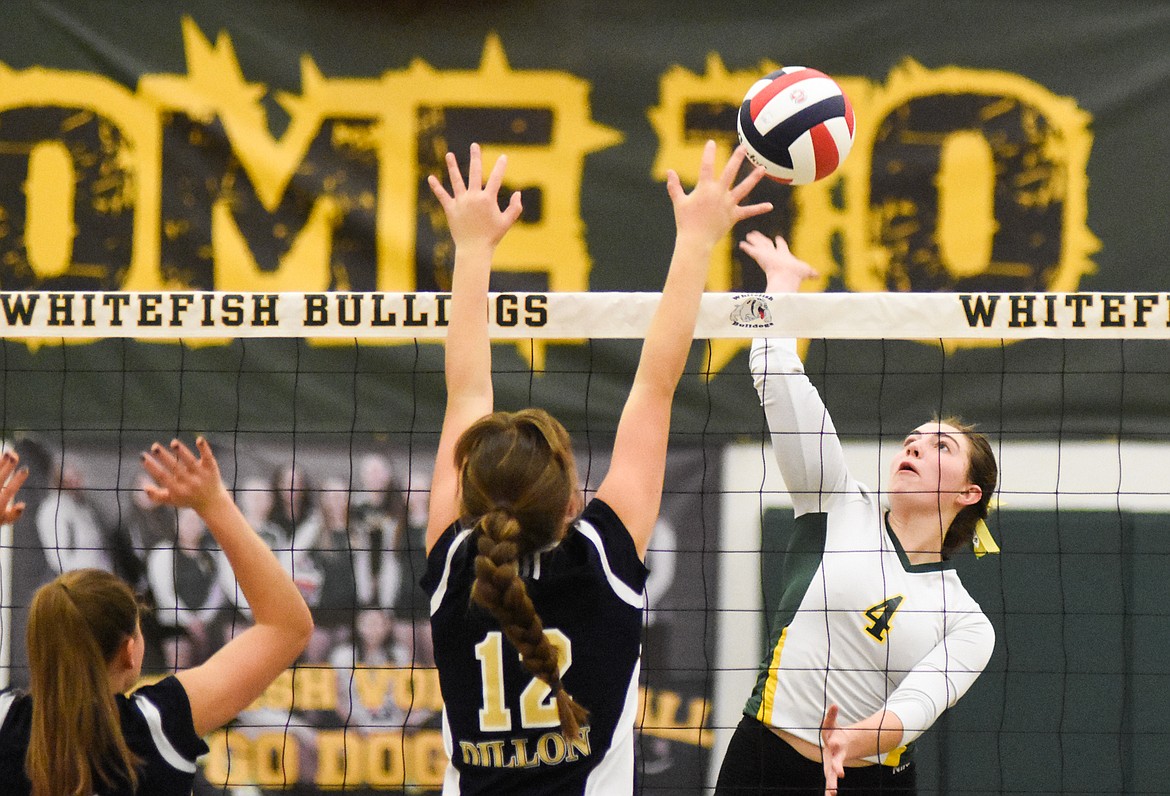 Luci Ridgeway rises for the spike against Dillon in the Western A Divisional Tournament last week at Whitefish High School. (Daniel McKay/Whitefish Pilot)