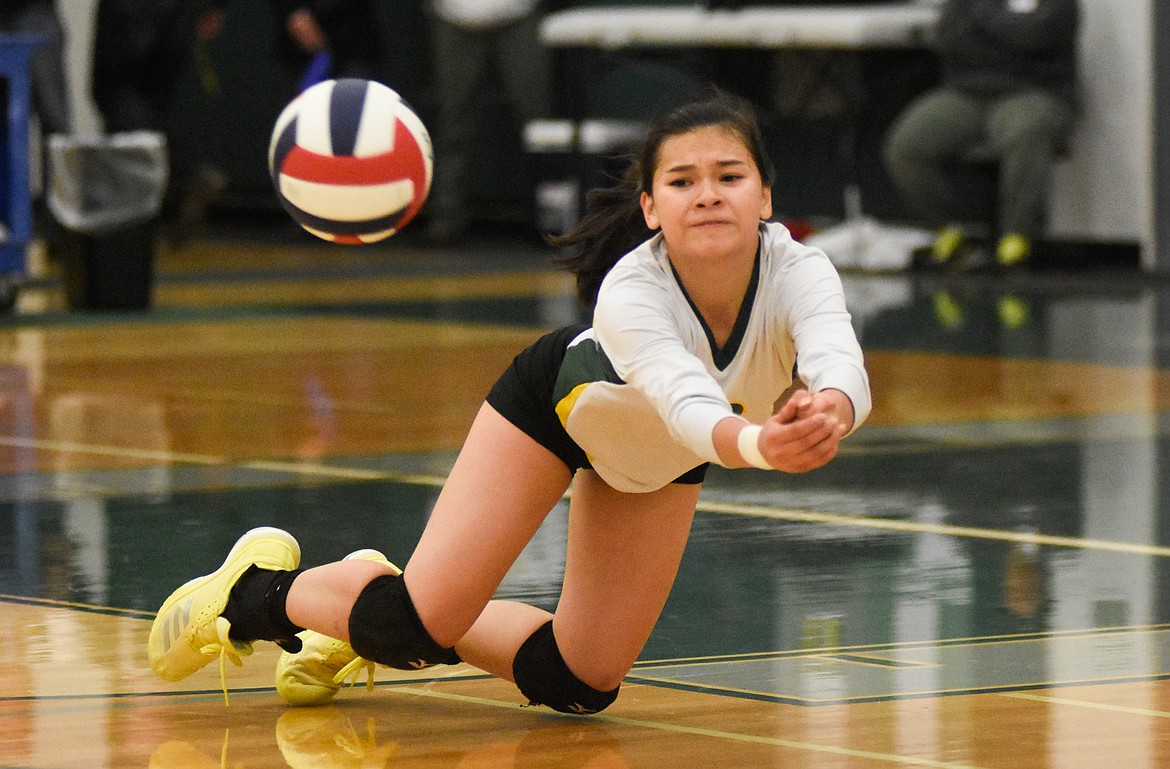 Jasmine Matern dives for the ball against Columbia Falls in the Western A Divisional Tournament last week at Whitefish High School. (Daniel McKay/Whitefish Pilot)