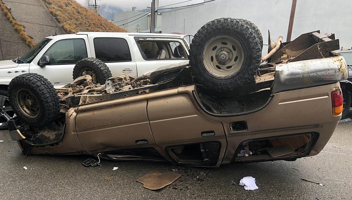 All three people in the upside down SUV were wearing seatbelts and walked away from the accident with minor injuries.