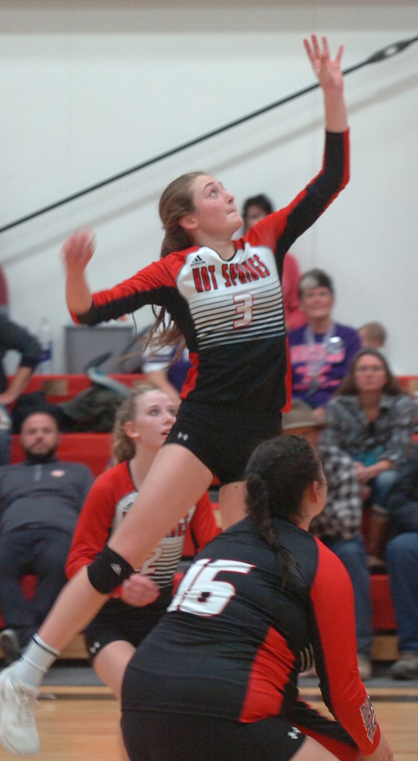 Katenlyn Christensen of Hot Springs goes high for a tip during the District 14C Tournament. Also pictured are Lady Savage Heat teammates Savannah Roosma (2) and Lizzy Fisher (16).