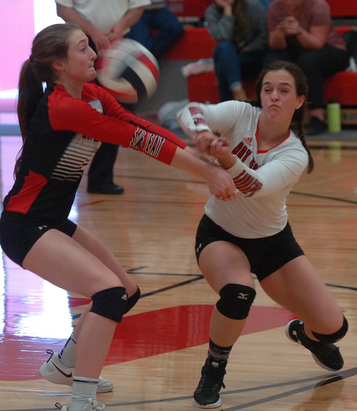 Hot Springs teammates Sage Jackson, right, and Katelyn Christensen attempt receipt of a serve during their match against Noxon in the first round of the District 14C Tournament last Thursday. The Lady Savage Heat came up a match win short of qualifying for the Western C Divisional Tournament. (Joe Sova photos/Clark Fork Valley Press)