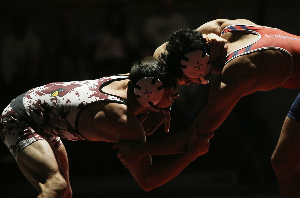 North Idaho College wrestler Dylan Lockwood locks with Clackamas wrestler Elijah Ozuna in the 141 pound match at NIC. (LOREN BENOIT/Press)