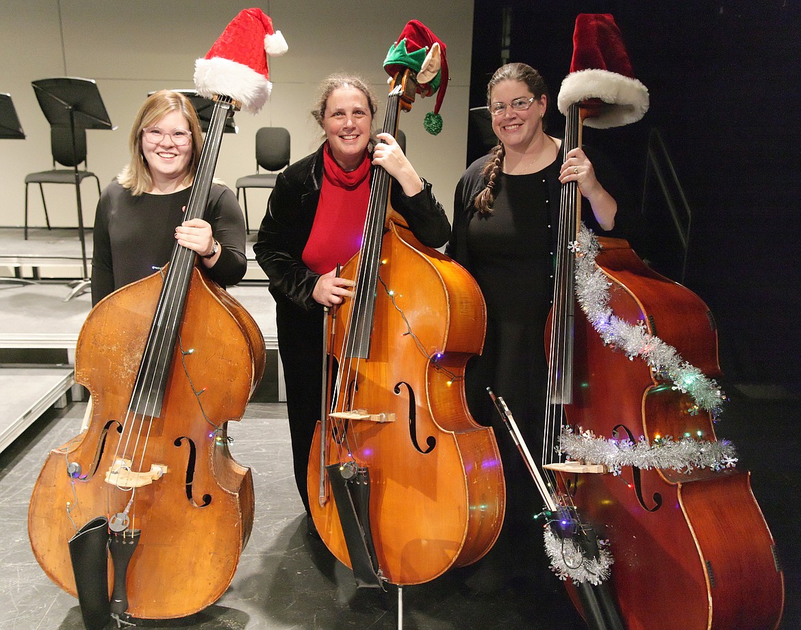 Coeur d'Alene Symphony musicians pose with decorated cellos during the 2017 holiday season. (Courtesy photo)