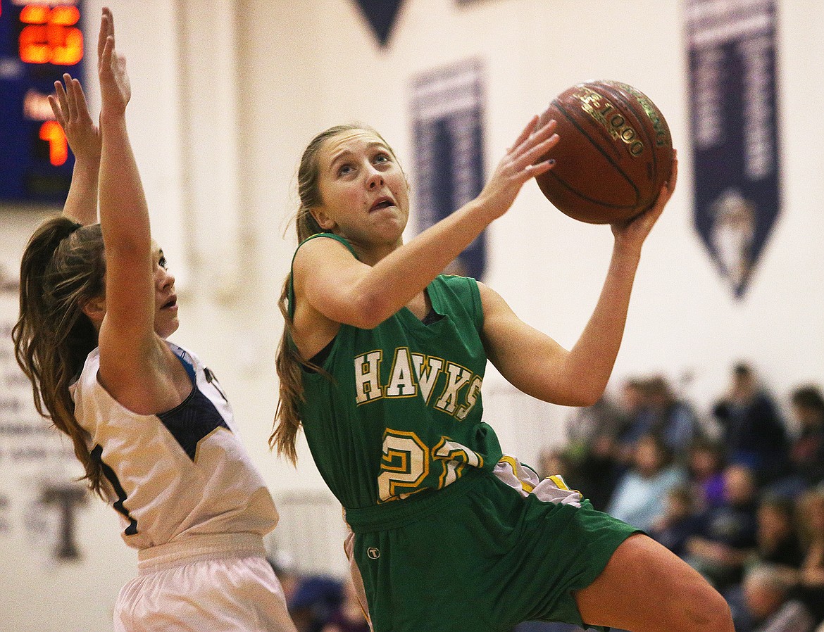 Lakeland&#146;s Mel Loutzenhiser drives hard into the paint for a layup against Timberlake in Tuesday night&#146;s game at Timberlake High School. (LOREN BENOIT/Press)