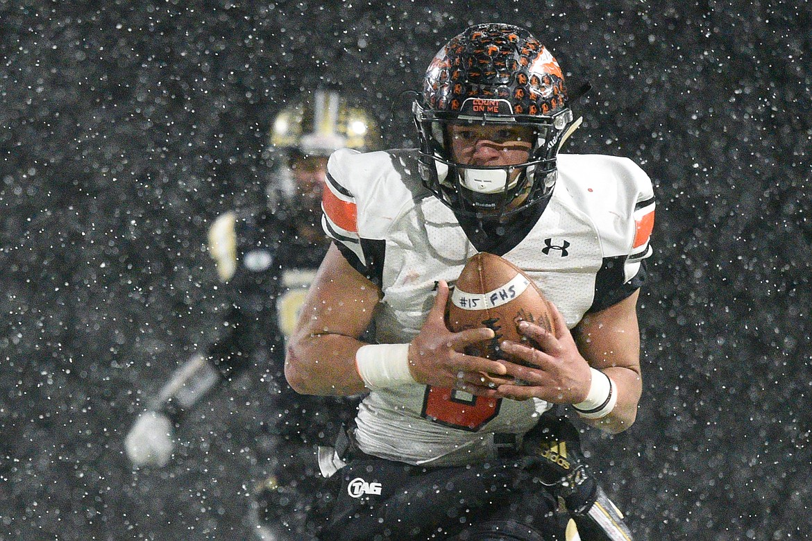 Flathead wide receiver Anthony Jones (8) hauls in a reception on the Braves&#146; last drive in the fourth quarter of a 20-14 loss to Billings West in the Class AA state championship at Wendy&#146;s Field at Daylis Stadium in Billings on Friday. (Casey Kreider/Daily Inter Lake)