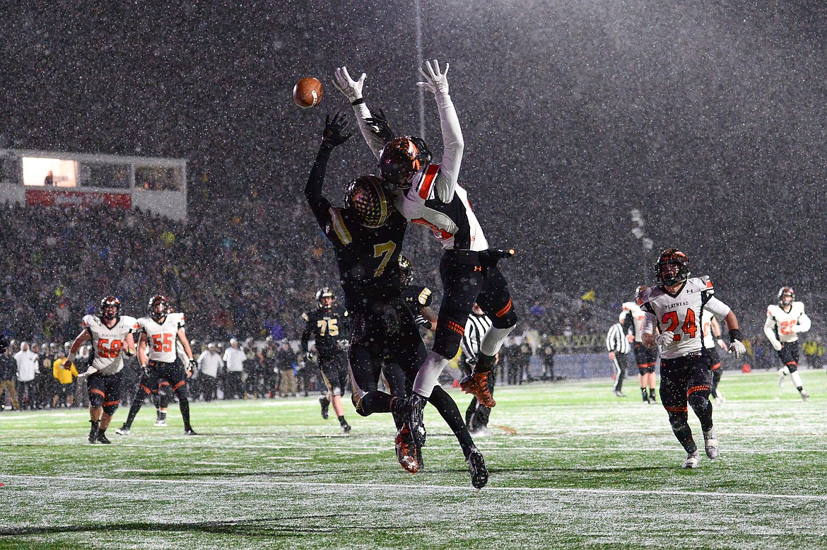 Billings West defensive back Lucas Gibb (7) breaks up a pass intended for Flathead tight end Jestin Bulik (18) on fourth down in the fourth quarter of the Class AA state championship at Wendy&#146;s Field at Daylis Stadium in Billings on Friday. (Casey Kreider/Daily Inter Lake)b