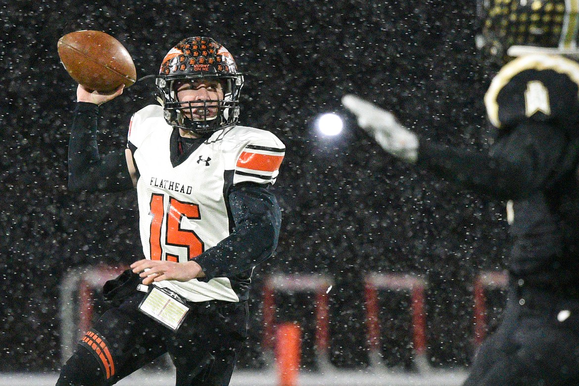 Flathead quarterback Jaden MacNeil (15) looks to pass in the third quarter against Billings West in the Class AA state championship at Wendy&#146;s Field at Daylis Stadium in Billings on Friday. (Casey Kreider/Daily Inter Lake)