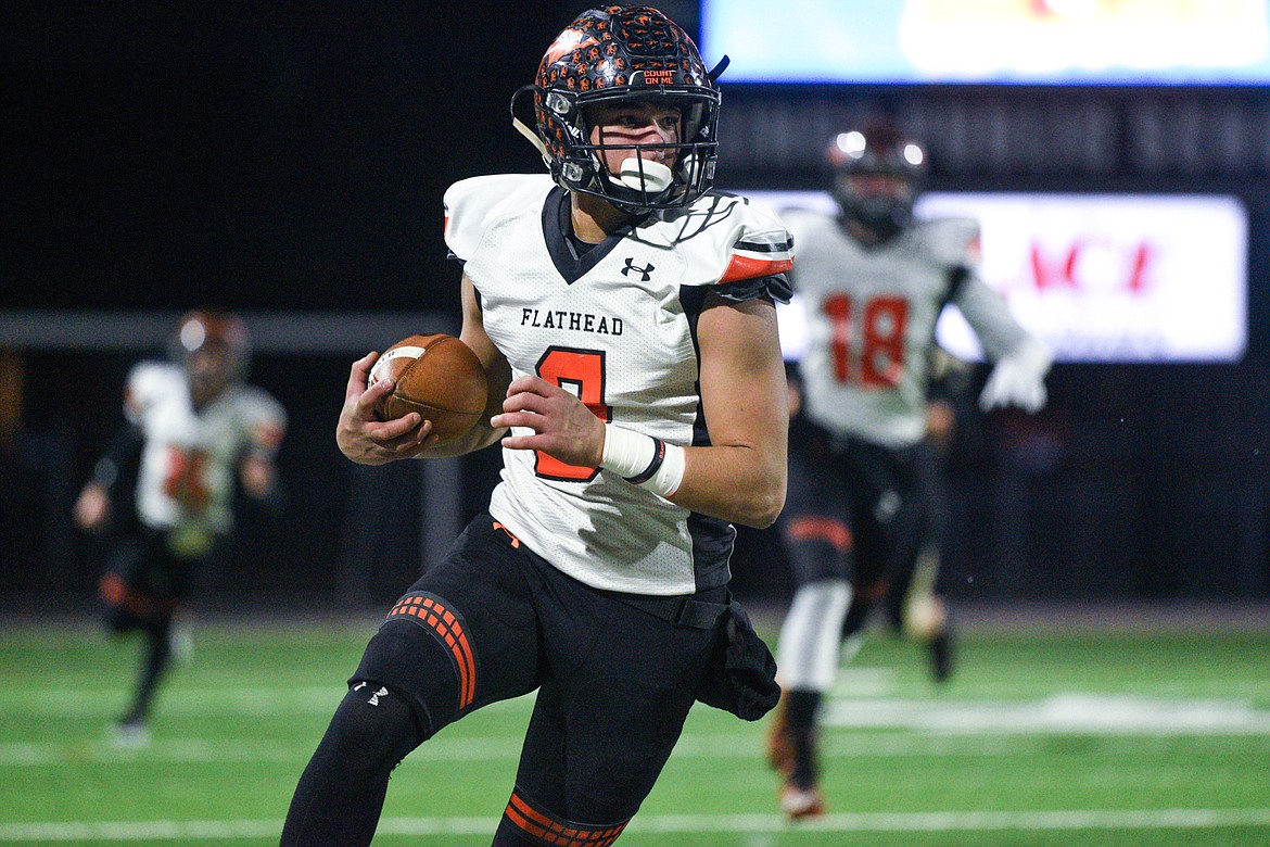 Flathead wide receiver Anthony Jones (8) heads upfield after a reception in the second quarter against Billings  West in the Class AA state championship at Wendy&#146;s Field at Daylis Stadium in Billings on Friday. (Casey Kreider/Daily Inter Lake)