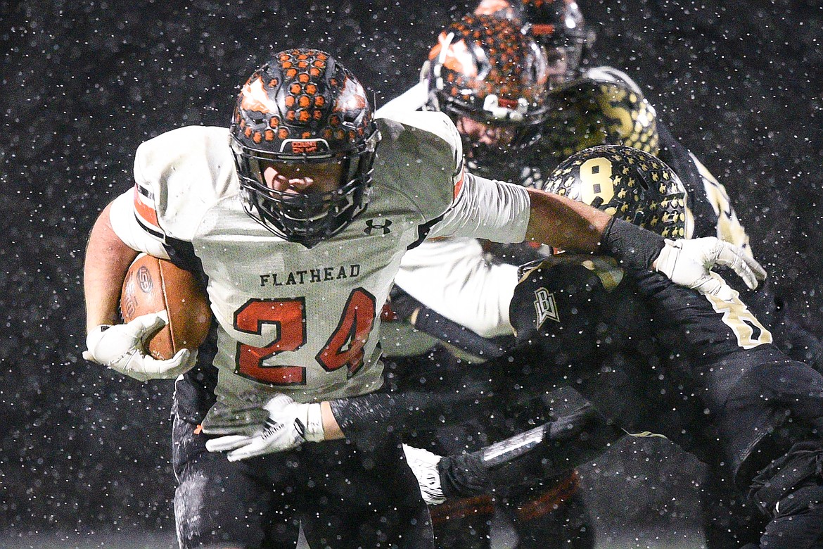 Flathead running back Blake Counts (24) breaks a fourth-quarter run against Billings West in the Class AA state championship at Wendy&#146;s Field at Daylis Stadium in Billings on Friday. (Casey Kreider/Daily Inter Lake)