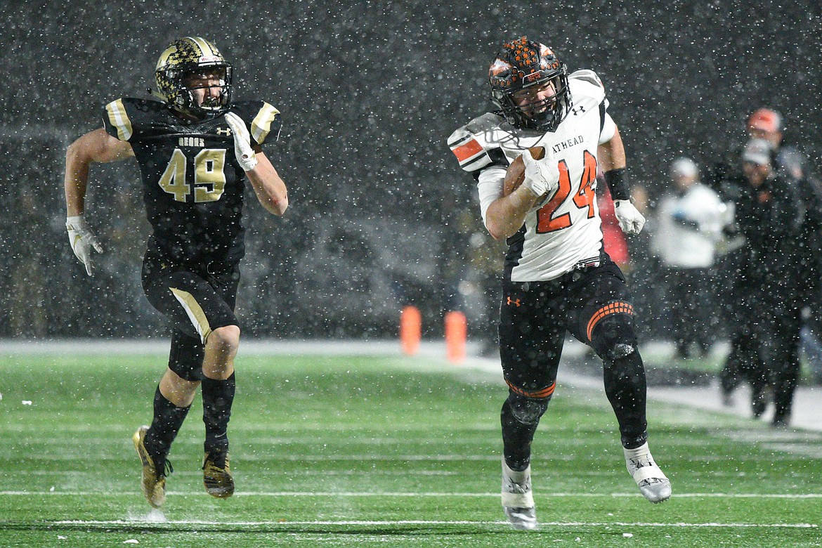 Flathead running back Blake Counts (24) breaks free on a fourth-quarter run that would put the Braves in scoring position down 20-14 in the Class AA state championship against Billings West at Wendy&#146;s Field at Daylis Stadium in Billings on Friday. (Casey Kreider/Daily Inter Lake)