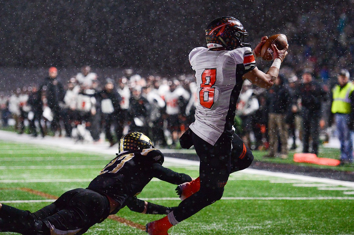 Flathead wide receiver Anthony Jones (8) catches a fourth-quarter touchdown reception from quarterback Jaden MacNeil (15) against Billings West in the Class AA state championship at Wendy&#146;s Field at Daylis Stadium in Billings on Friday. (Casey Kreider/Daily Inter Lake)