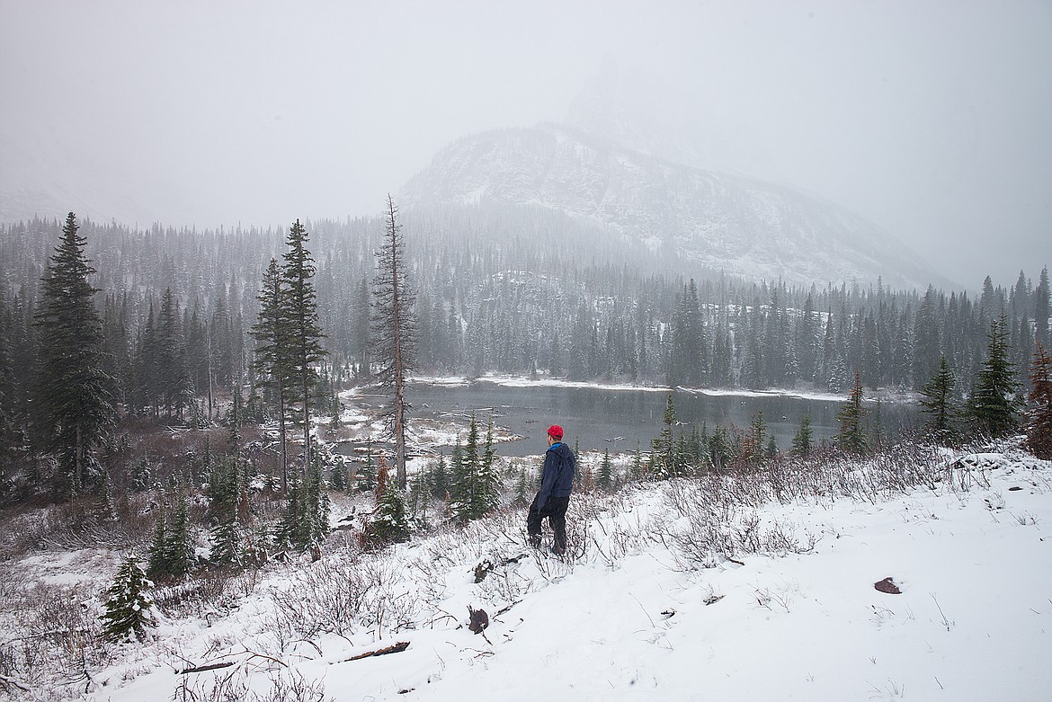 Snow falls Sunday in the higher terrain of Glacier National Park.