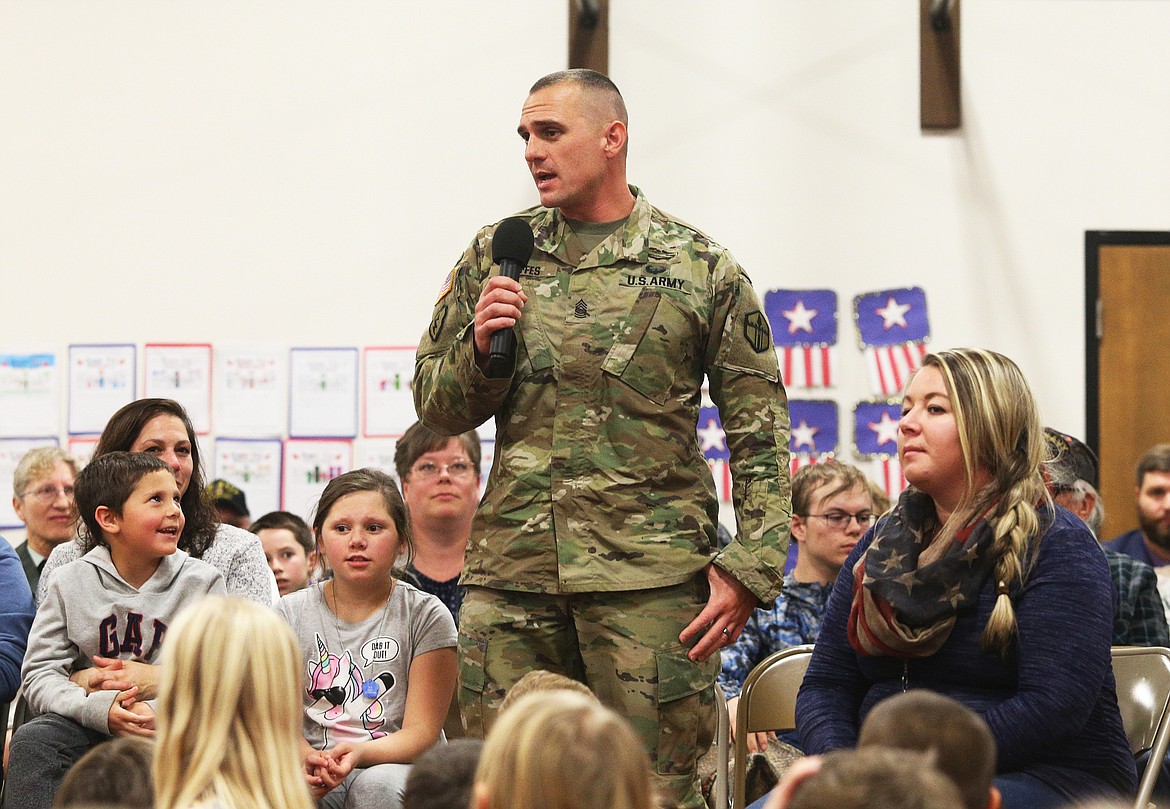 Master Sgt. David Steffes is recognized for his service during Spirit Lake Elementary School's Veterans Day assembly on Monday. Steffes has served in the U.S. Army for 17 years. (LOREN BENOIT/Press)