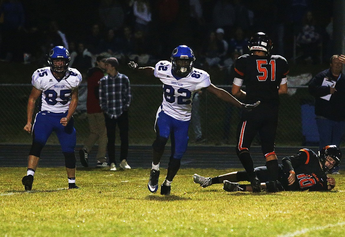 Coeur d&#146;Alene&#146;s Nate Burch (82) and Ryan Linehan (85) celebrate a quarterback sack in a game against Post Falls High School on Oct. 29.