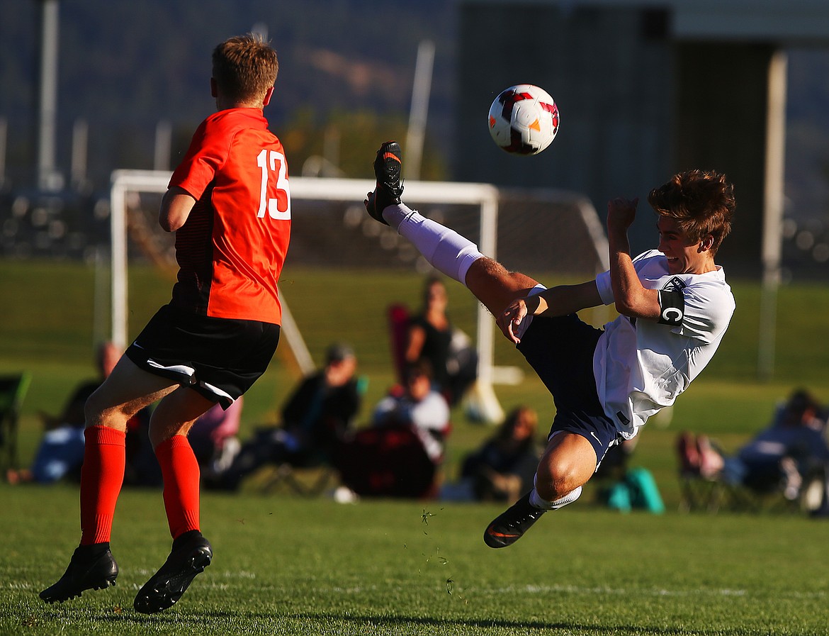 Lake City&#146;s Spencer Messina bicycle kicks the ball to the Post Falls goal in a match on Sept. 18 in Post Falls.