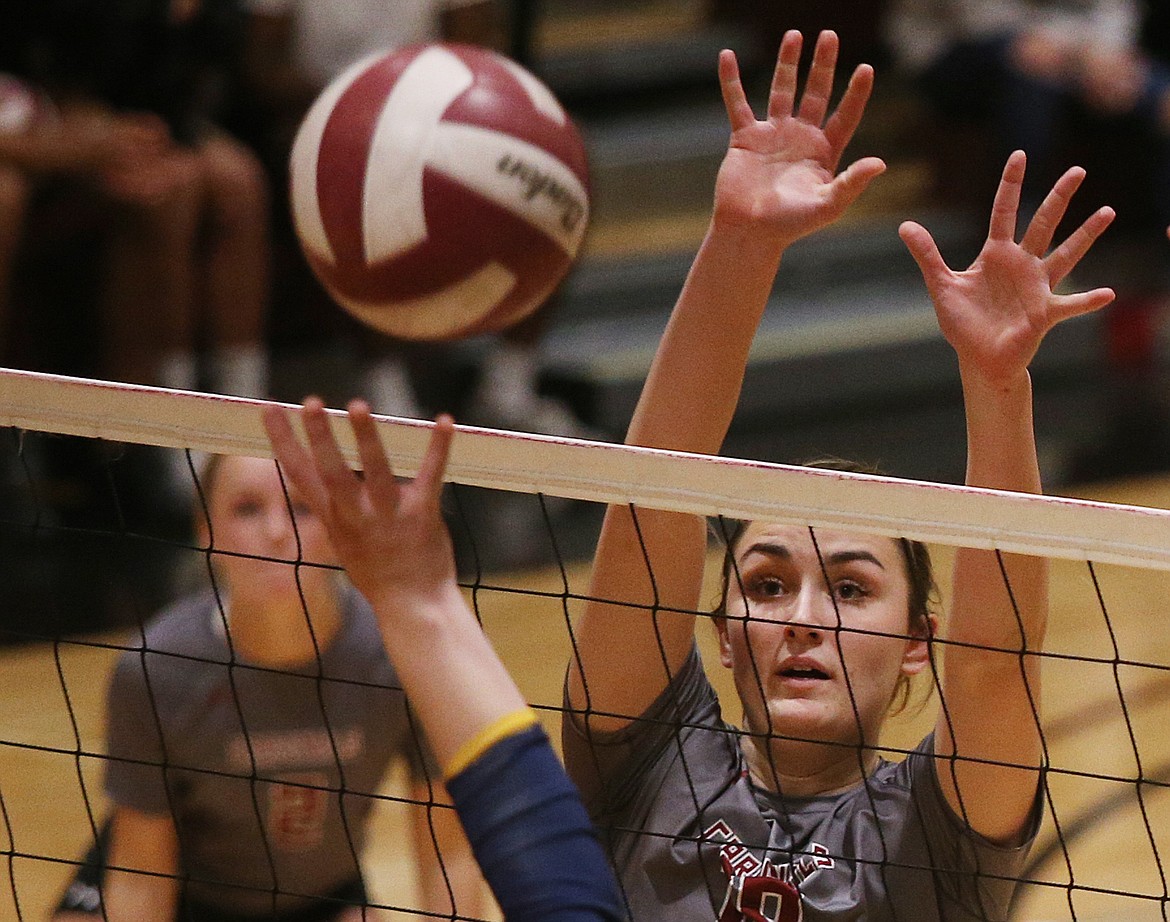 Chelsea Taylor of North Idaho College goes for a block in a volleyball match against Community Colleges of Spokane on Oct. 3.