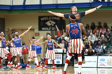 Harlem Globetrotter "Hi-Lite" dances with a fan during an intermission at Glacier High School on Tuesday, Nov. 13. (Casey Kreider/Daily Inter Lake)