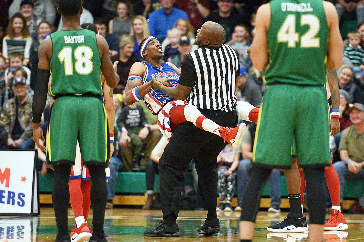 Harlem Globetrotter &quot;Hi-Lite&quot; jokes around with a referee during a game against the Washington Generals at Glacier High School on Tuesday, Nov. 13. (Casey Kreider/Daily Inter Lake)