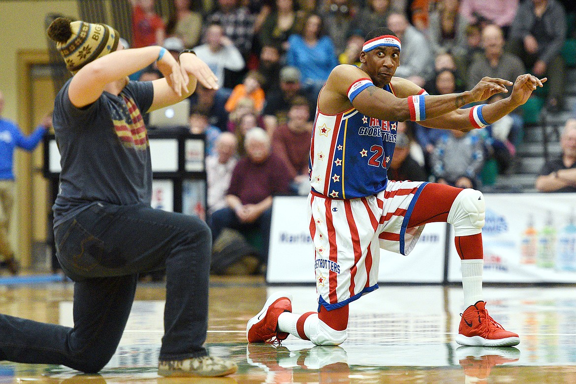 Harlem Globetrotter &quot;Hi-Lite&quot; dances with a fan during an intermission at Glacier High School on Tuesday, Nov. 13. (Casey Kreider/Daily Inter Lake)