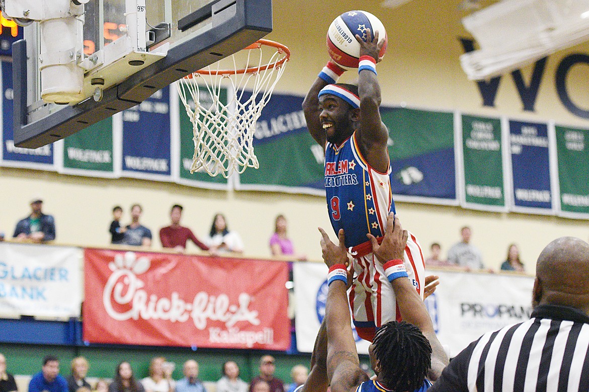 Harlem Globetrotter &quot;Hot Shot&quot; throws down a dunk against the Washington Generals at Glacier High School on Tuesday, Nov. 13. (Casey Kreider/Daily Inter Lake)