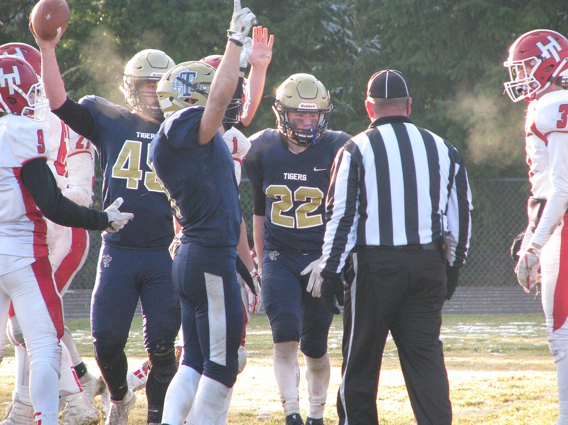 MARK NELKE/Press
Timberlake players celebrate a third-quarter touchdown by Jeremy McLemore (45) against Homedale on Saturday.