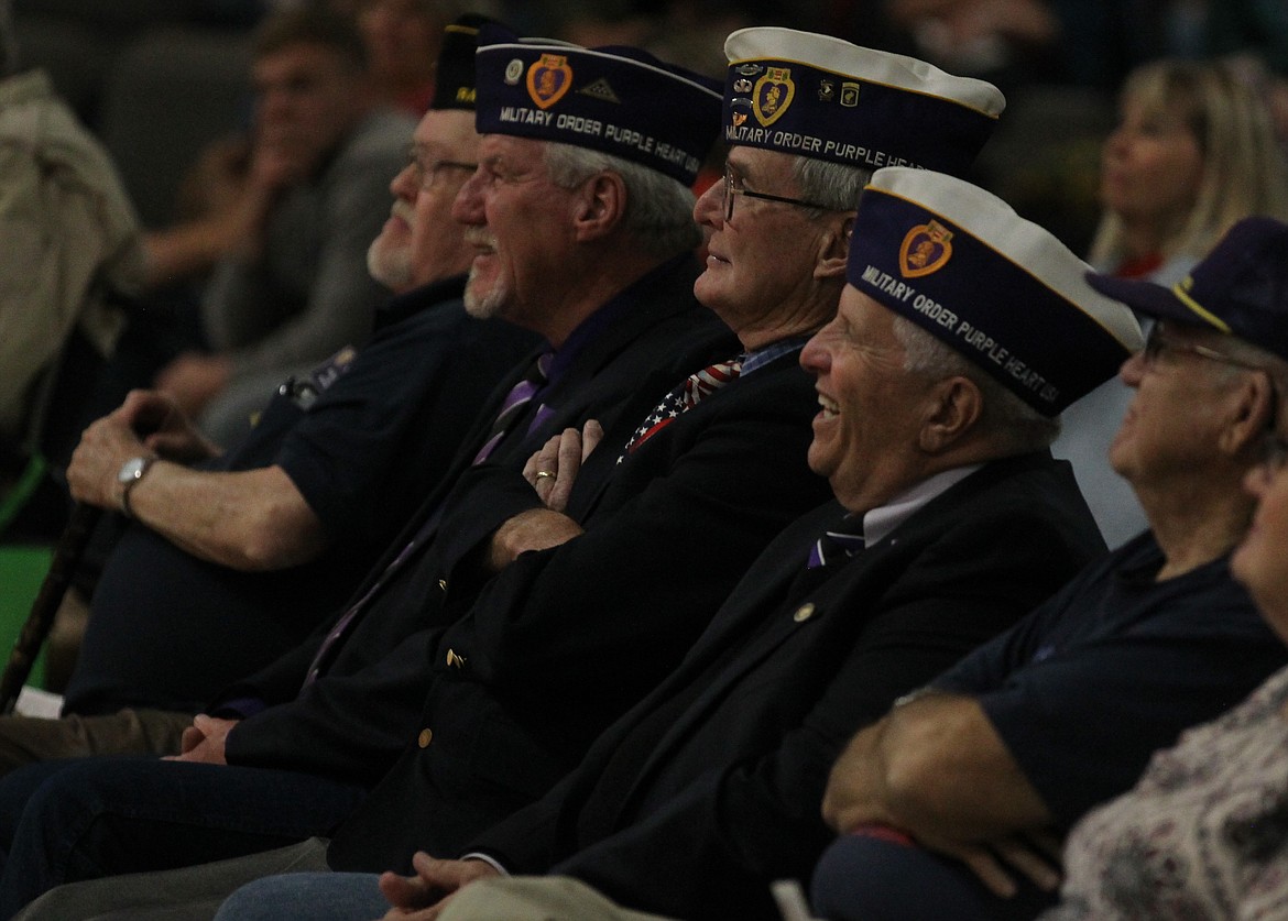 From left, American Legion Post 154 Sergeant-at-Arms Bill Kinder and Military Order of the Purple Heart representatives Bill Hamilton, Walt Jackson, Donald &#147;Italian Stallion&#148; Turano and Wayne Winkelkotter react to a more lighthearted moment in decorated Vietnam veteran Les Crosby&#146;s speech Saturday during the fourth annual Veterans Recognition Day program in Lakeland High School in Rathdrum. The event was well-attended and featured special prizes for Kootenai County&#146;s oldest and youngest veterans, as well as opportunities to shake their hands and remind them that North Idaho salutes them. (DEVIN WEEKS/Press)