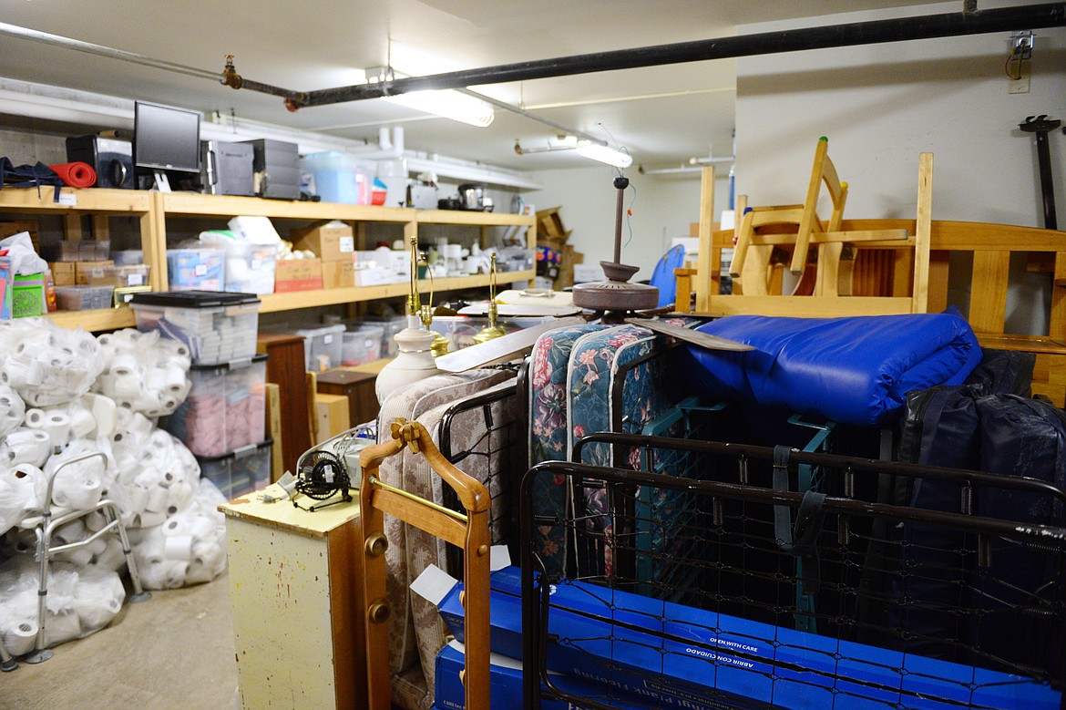 Basement storage areas house a wide array of personal items from clothing and shoes to spare beds and furniture that residents can use for free at Samaritan House in Kalispell on Friday, Nov. 9. (Casey Kreider/Daily Inter Lake)