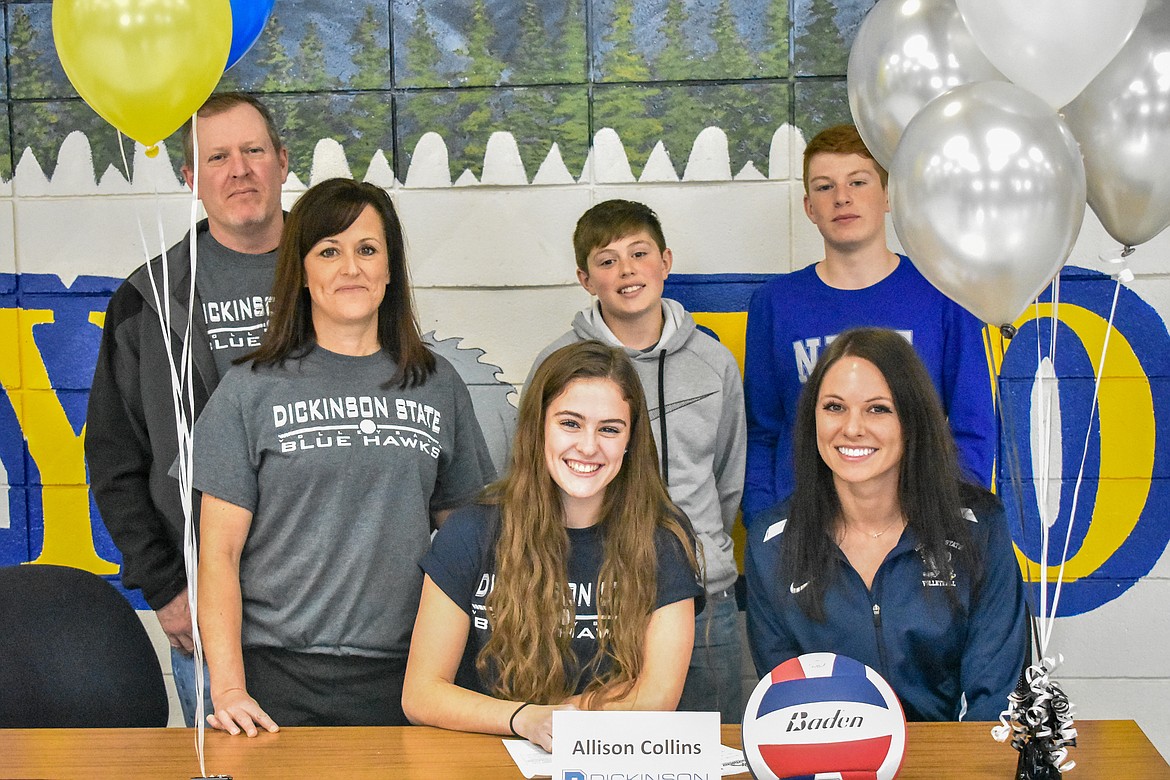 Libby senior Alli Collins signed to play volleyball at Dickinson State University in Dickinson, North Dakota, during a short ceremony on Wednesday. Pictured are parents Chad and Paula Collins, brothers Trevor and Ryan Collins, Alli Collins and Dickinson Head Coach Jennifer Hartman. (Ben Kibbey/The Western News)