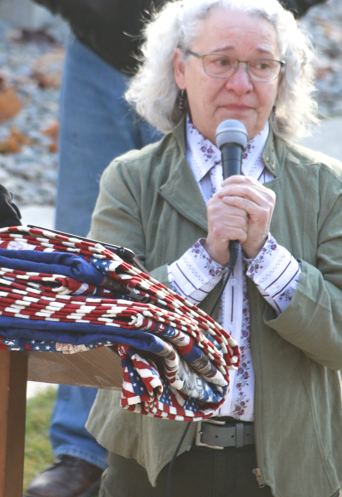 Photo by MANDI BATEMAN
Margaret Pyette took to the podium with her two intricate, patriotic, handmade quilts, and moved the audience with her speech.