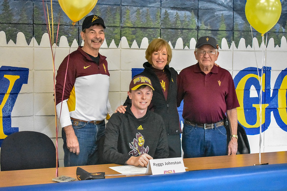 Libby senior Ryggs Johnston signed to play golf with Arizona State University during a short ceremony Wednesday at Libby High School. Pictured are father Roger Johnston, mother Cindy Ostrem-Johnston, grandfather Norm Ostrem and Ryggs Johnston. (Ben Kibbey/The Western News)