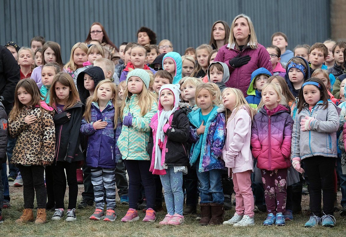 Libby Elementary School students and teachers participate in a flag ceremony in honor of Veterans Day Monday, Nov. 12, 2018. (John Blodgett/The Western News)