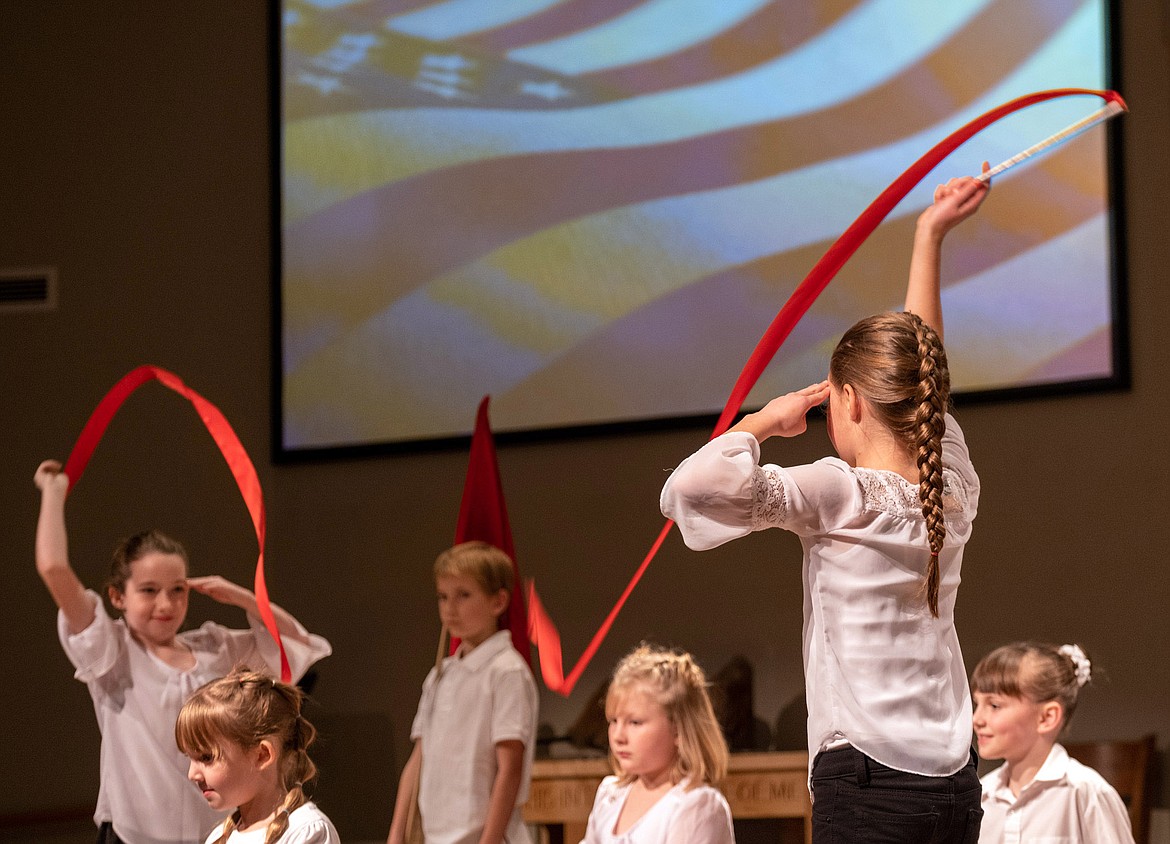 Third- and fourth-grade students from Kootenai Valley Christian School perform &#147;There She Stands&#148; during the school&#146;s 22nd annual Veterans Day program at Libby Christian Church Friday, Nov. 9, 2018. (John Blodgett/The Western News)