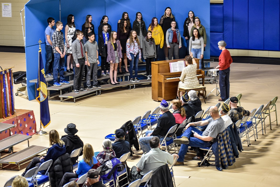 The Libby High School Choir &#151; led by Lorraine Braun &#151; performs the Battle Hymn of the Republic during the Veterans Day observance in the Ralph Tate Memorial Gymnasium at Libby High School Monday. (Ben Kibbey/The Western News)