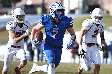 Columbia Falls running back Colten McPhee (7) breaks free on a 69-yard touchdown run in the first quarter against Hamilton in a Class A semifinal playoff game at Columbia Falls High School on Saturday. (Casey Kreider/Daily Inter Lake)