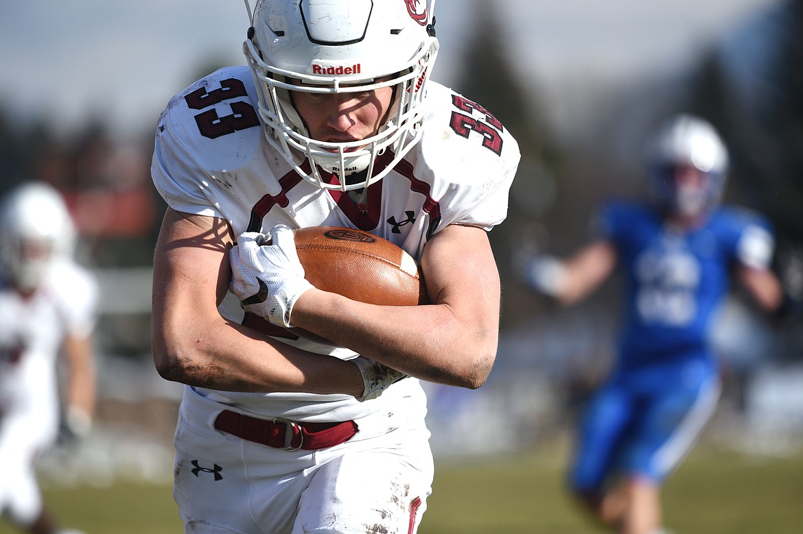 Hamilton running back Michael Golden (33) scores a first-quarter touchdown on an 11-yard reception against Columbia Falls in a Class A semifinal playoff game at Columbia Falls High School on Saturday. (Casey Kreider/Daily Inter Lake)