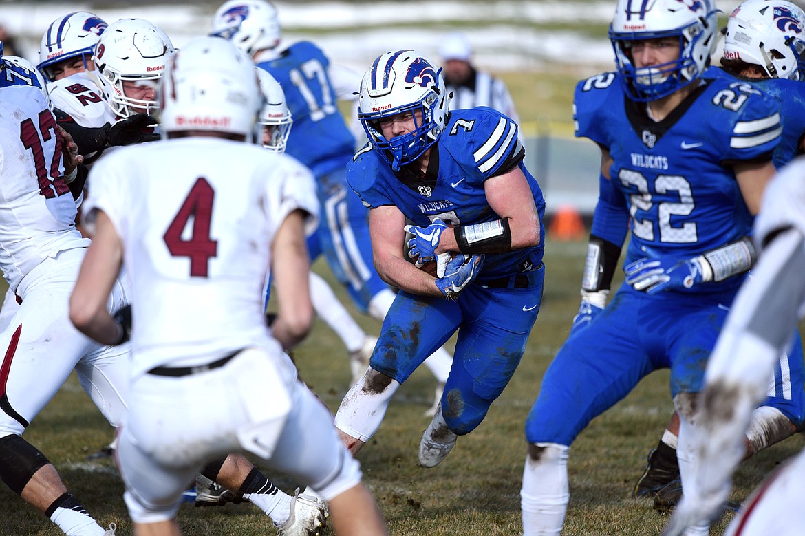 Columbia Falls running back Colten McPhee (7) looks for room to run against Hamilton in a Class A semifinal playoff game at Columbia Falls High School on Saturday. (Casey Kreider/Daily Inter Lake)