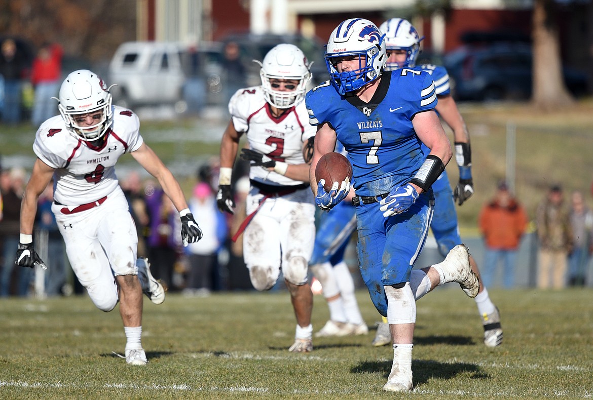 Columbia Falls running back Colten McPhee (7) heads to the end zone on a 33-yard touchdown run in the third quarter against Hamilton in a Class A semifinal playoff game at Columbia Falls High School on Saturday. (Casey Kreider/Daily Inter Lake)