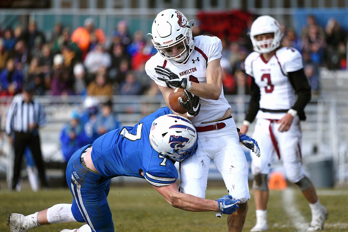 Hamilton wide receiver Caden Brown (4) is tackled in the backfield by Columbia Falls linebacker Colten McPhee (7) in the second quarter in a Class A semifinal playoff game at Columbia Falls High School on Saturday. (Casey Kreider/Daily Inter Lake)