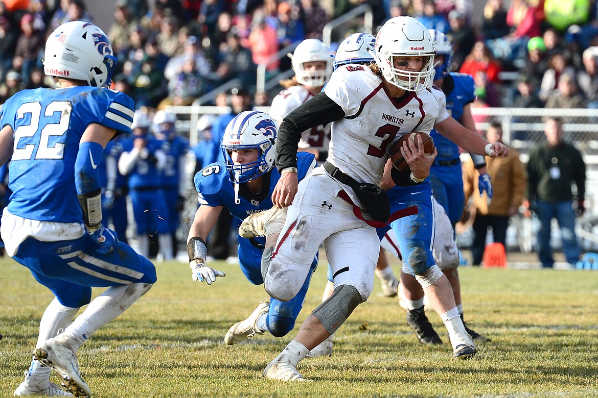 Hamilton quarterback Carson Rostad (3) runs in a third-quarter touchdown against Columbia Falls in a Class A semifinal playoff game at Columbia Falls High School on Saturday. (Casey Kreider/Daily Inter Lake)