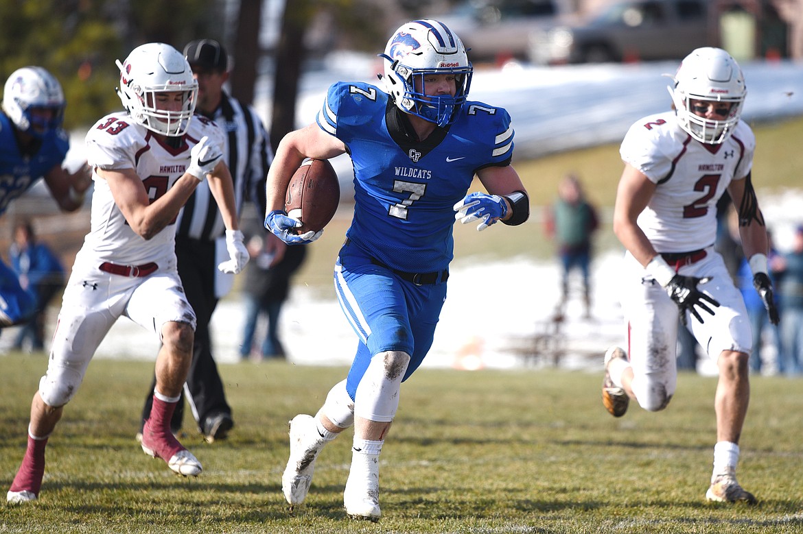 Columbia Falls running back Colten McPhee (7) breaks free on a 69-yard touchdown run in the first quarter against Hamilton in a Class A semifinal playoff game at Columbia Falls High School on Saturday. (Casey Kreider/Daily Inter Lake)