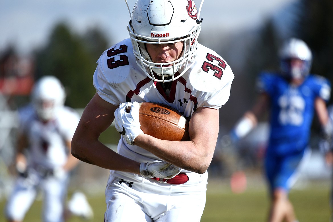 Hamilton running back Michael Golden (33) scores a first-quarter touchdown on an 11-yard reception against Columbia Falls in a Class A semifinal playoff game at Columbia Falls High School on Saturday. (Casey Kreider/Daily Inter Lake)