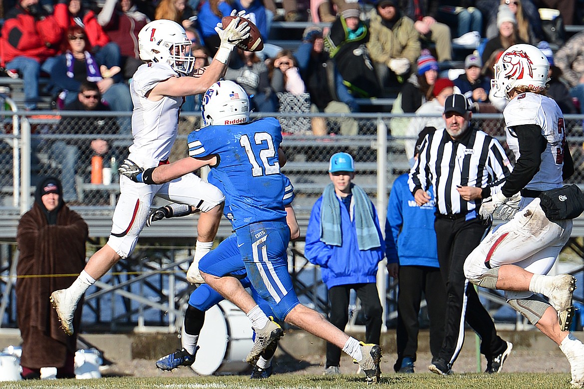 Hamilton defensive back Camron Rothie (1) intercepts a pass by Columbia Falls quarterback Drew Morgan (17) in the second quarter in a Class A semifinal playoff game at Columbia Falls High School on Saturday. (Casey Kreider/Daily Inter Lake)